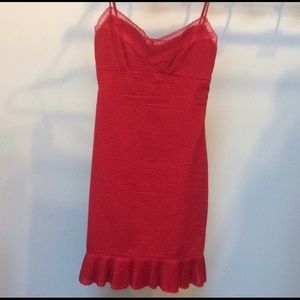 Red dress with lace and ruffled bottom.